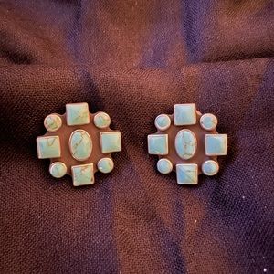 Sterling silver handmade turquoise inlaid clip on earrings.